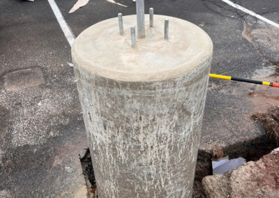 Concrete base for pole lighting repairs in a commercial parking lot