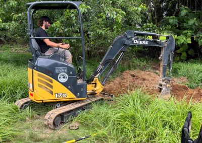 Excavating a trench for underground electrical wiring